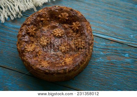 Round Loaf Karavai On Wooden Rustic Table Background. Traditional Slavic Russian And Ukranian Festiv