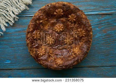 Round Loaf Karavai On Wooden Rustic Table Background. Traditional Slavic Russian And Ukranian Festiv