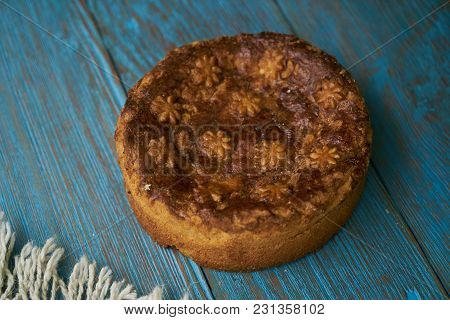 Round Loaf Karavai On Wooden Rustic Table Background. Traditional Slavic Russian And Ukranian Festiv