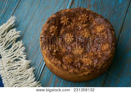 Round Loaf Karavai On Wooden Rustic Table Background. Traditional Slavic Russian And Ukranian Festiv