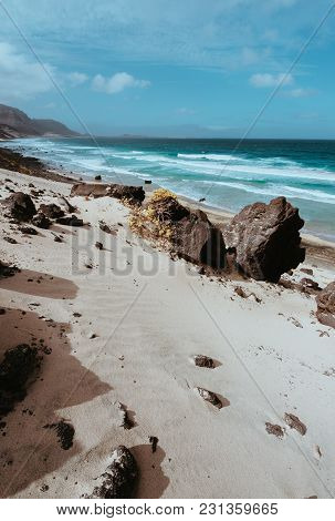 Huge Volcanic Stone Boulder On Spectacular White Sand Dunes Of Remote Deserted Beach Praia Grande. O