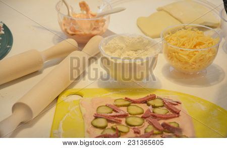 Making Pizza Dough And Preparing Pizza Ingredients In Kitchen.