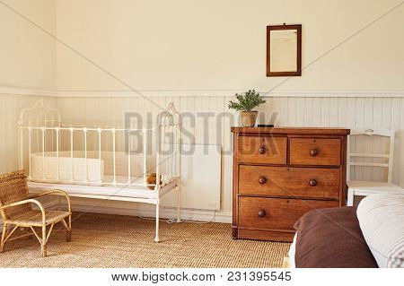 Cot In The Comfortable Bedroom Of A Country Home