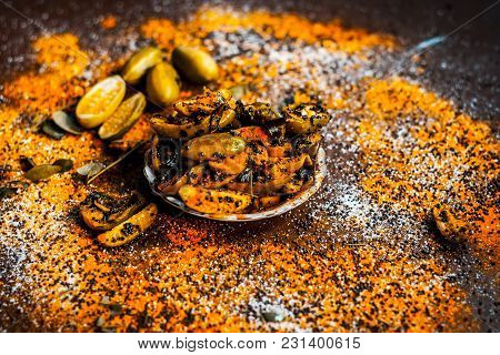 Popular Indian Squash Pickle Or Tinda Nu Athnu Or Achar In A Glass Plat With All Its Ingredients And