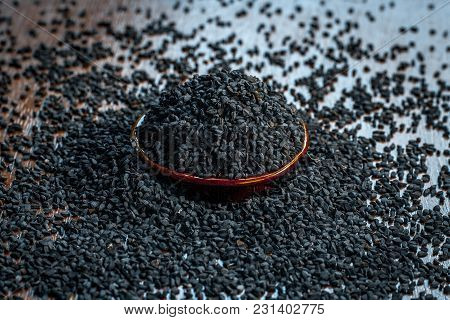 Close Up Of An Essential Beneficial Ayurvedic Herb I.e Kalonji Or Black Caraway In A Wooden Plate On