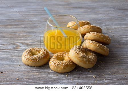 Traditional Greek Easter Biscuits Paskhalina Kuluria With Sesame Seeds On A Wooden Table, Selective 