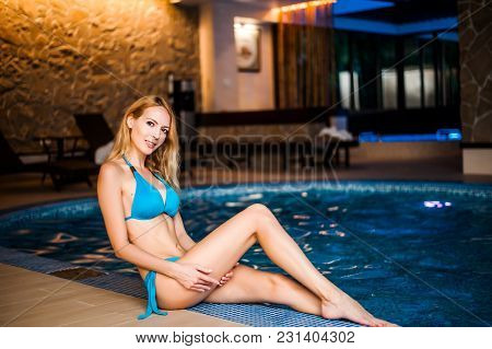 Girl In Bikini Sits At Hotel Spa Zone