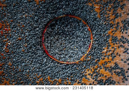 Close Up Of An Essential Beneficial Ayurvedic Herb I.e Kalonji Or Black Caraway In A Wooden Plate On