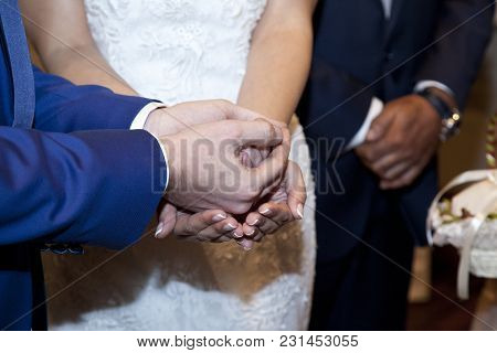 Detail Of The Hands Of The Bride And Groom When The Bridegroom Gives The Bride The Arras, During The