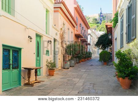 Small Paved Street Of Placa District With Acropolis Hill In Old Town Of Athens, Greece