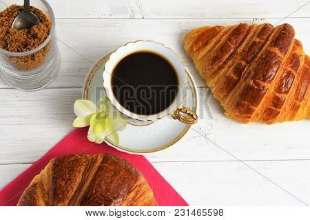 Vintage Coffee Cup With Espresso On A Saucer, Croissant On The Rose Table-napkin And Some Biscuits ,