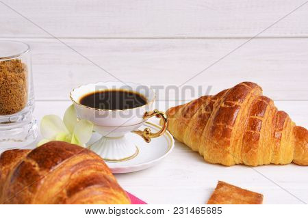 Vintage Coffee Cup With Espresso On A Saucer, Croissant On The Rose Table-napkin And Some Biscuits ,