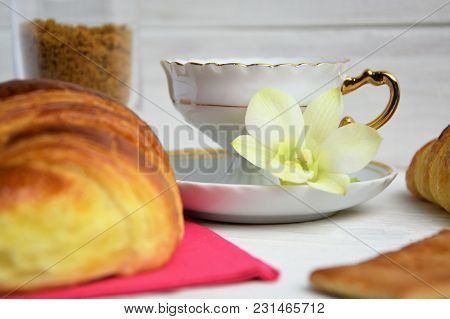 Vintage Coffee Cup With Espresso On A Saucer, Croissant On The Rose Table-napkin And Some Biscuits ,