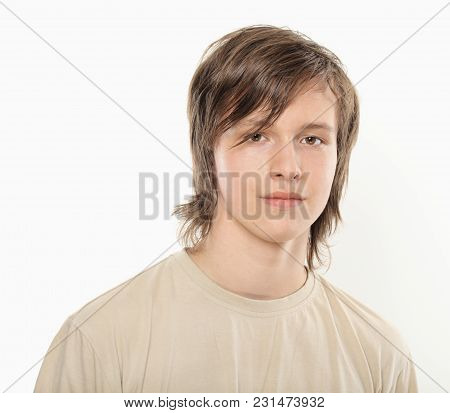 Thoughtful Young Boy In Light Brown Shirt