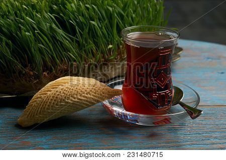 National Azerbaijan Pastry Shekerbura With Nuts And Honey And Glass Of Black Tea On Wooden Table Wit
