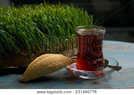 National Azerbaijan Pastry Shekerbura With Nuts And Honey And Glass Of Black Tea On Wooden Table Wit