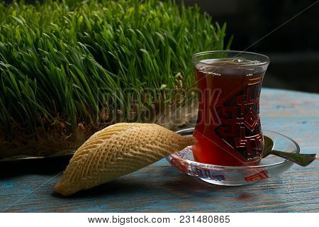 National Azerbaijan Pastry Shekerbura With Nuts And Honey And Glass Of Black Tea On Wooden Table Wit