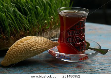 National Azerbaijan Pastry Shekerbura With Nuts And Honey And Glass Of Black Tea On Wooden Table Wit