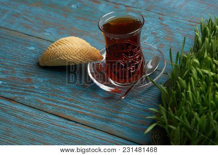 National Azerbaijan Pastry Shekerbura With Nuts And Honey And Glass Of Black Tea On Wooden Table Wit