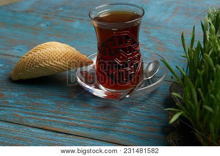 National Azerbaijan Pastry Shekerbura With Nuts And Honey And Glass Of Black Tea On Wooden Table Wit