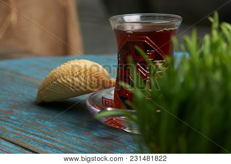 National Azerbaijan Pastry Shekerbura With Nuts And Honey And Glass Of Black Tea On Wooden Table Wit