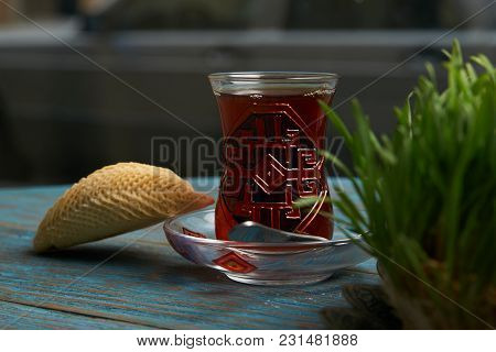 National Azerbaijan Pastry Shekerbura With Nuts And Honey And Glass Of Black Tea On Wooden Table Wit