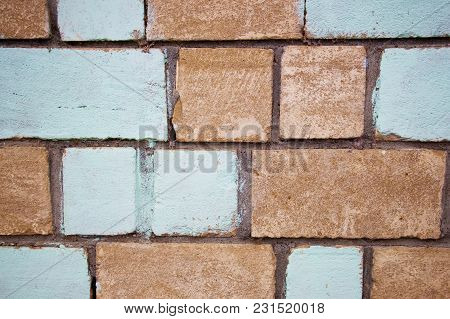 Close-up Of A Wall Texture Of An Old Solid Image Background With A Multicolored Bricks Background.