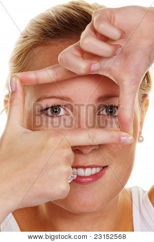 Woman looking through a frame