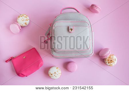 Top View Of Tasty Pink And White Macaroons Raspberry And Vanilla Flavor And Backpack