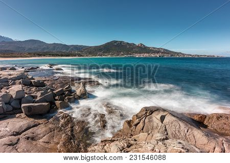 Waves Washing Onto Rocks Near Algajola Beach In Corsica