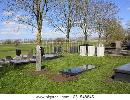 Dorkwerd. April-28-2013. Tombstones At The Cemetery In Dorkwerd. The Netherlands