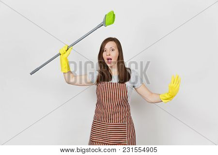 Young Shocked Housewife In Striped Apron, Yellow Gloves Isolated On White Background. Housekeeper Wo