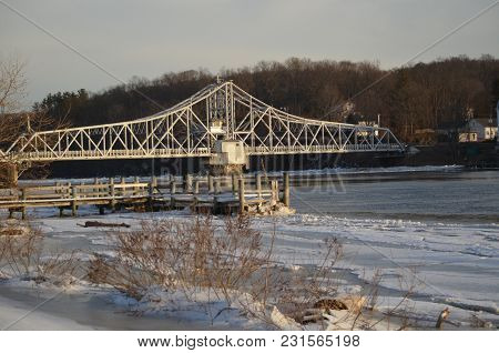 A Swing Bridge Spanning The Ct. River In Winter