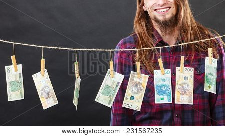 Riches And Fortune. Young Happy Man With A Lot Of Money On Black Background. Winning The Lottery Con