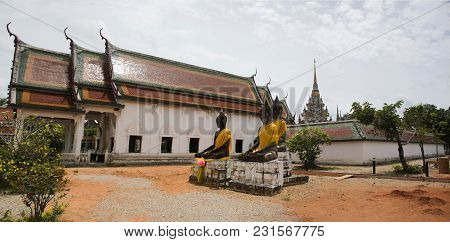 Three Buddha Brother Statue Beside Ubosot And Chedi Of Wat Phra Borommathat Chaiya Temple In Chaiya 