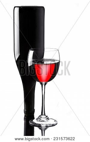 Wine In Glass With Bottle On Whiote Background