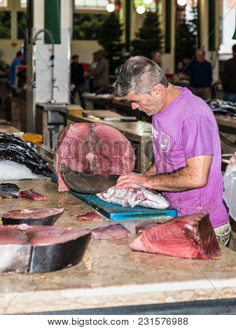 Funchal, Portugal - December 10, 2016: Seller Of Fish In The Funchal Fish Market Mercado Dos Lavrado