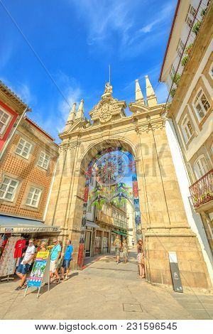 Braga, Portugal - August 12, 2017: Front Facade Of Arco Da Porta Nova, Looking East Along Rua Dom Di