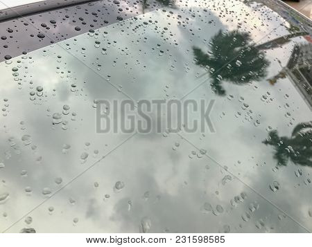 Water Drop And Back Glass Windshield Of The Car