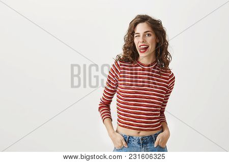 I Am About To Eat You. Joyful Sexy Woman With Curly Hairstyle, Wearing Fashionable Cropped Top, Stic