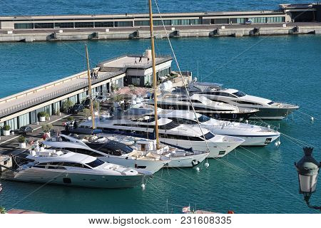 Monte-carlo, Monaco - March 17, 2018: Luxurious Yachts And Megayachts Lined Up In The Monte-carlo Ha