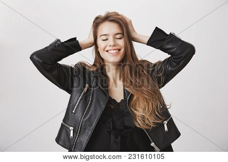 Feeling Independent And Carefree. Upbeat Attractive Caucasian Female Holding Hands On Head, Closing 