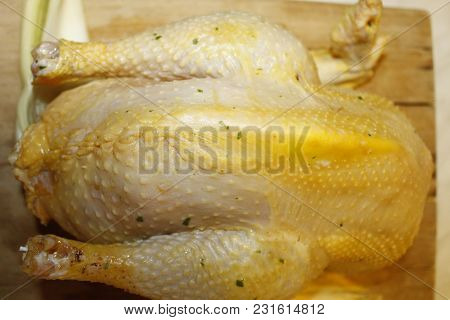 Homemade Stuffed Capon On Wooden Cutting Board