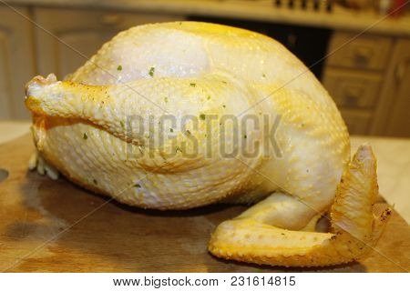 Homemade Stuffed Capon On Wooden Cutting Board
