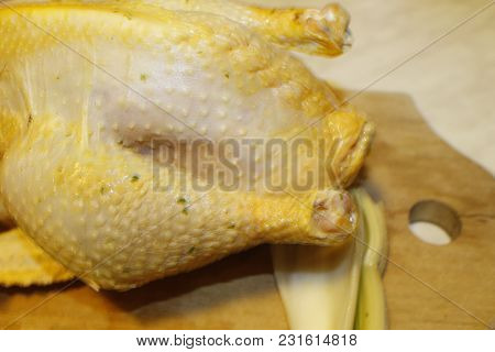 Homemade Stuffed Capon On Wooden Cutting Board