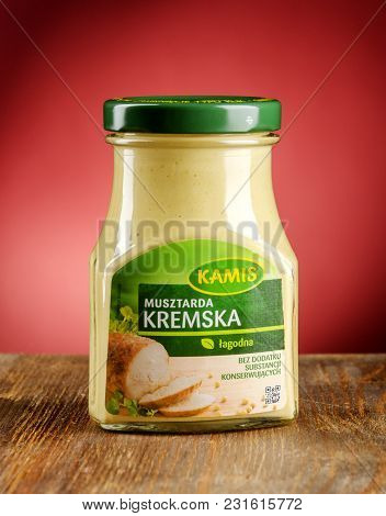 Kwidzyn, Poland - March 17, 2018: Kamis Mustard On Gradient Background. Kamis Was Founded In Poland 