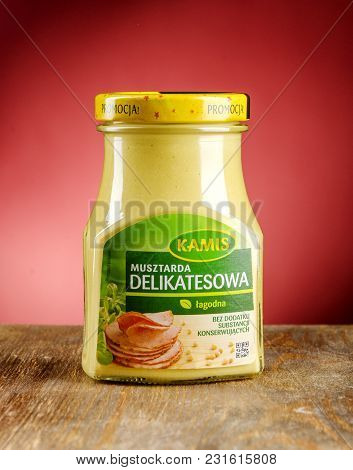 Kwidzyn, Poland - March 17, 2018: Kamis Mustard On Gradient Background. Kamis Was Founded In Poland 