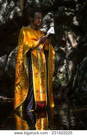 KOH CHANG, THAILAND - MAR 10, 2018: During Christian sacrament of spiritual birth - Baptism. There are currently 10 Orthodox parishes in Thailand, Orthodoxy is practiced by 0.002% of population.