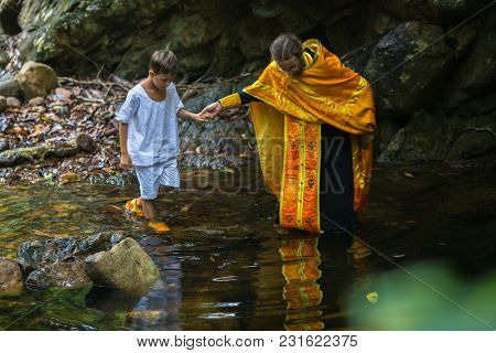 KOH CHANG, THAILAND - MAR 9, 2018: During Christian sacrament of spiritual birth - Baptism. There are currently 10 Orthodox parishes in Thailand, Orthodoxy is practiced by 0.002% of population.