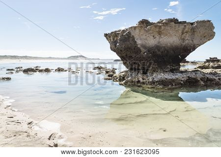 Rock Formation With Reflection And Light Clear Oceanwater At Peterborough Beach Along The Great Ocea